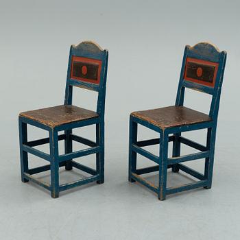 a pair of early 20th century chairs.