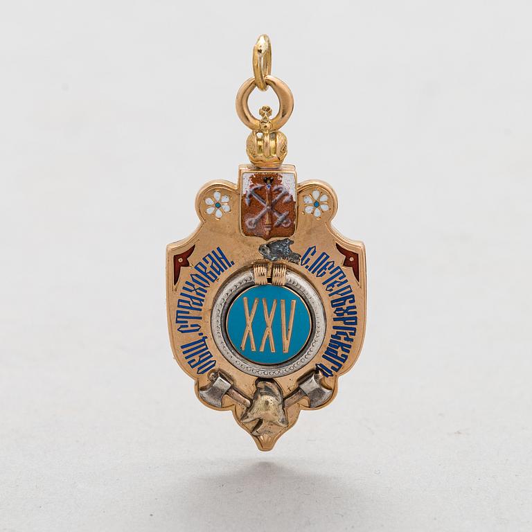 A 14K gold and enamel jetton. Moskow.