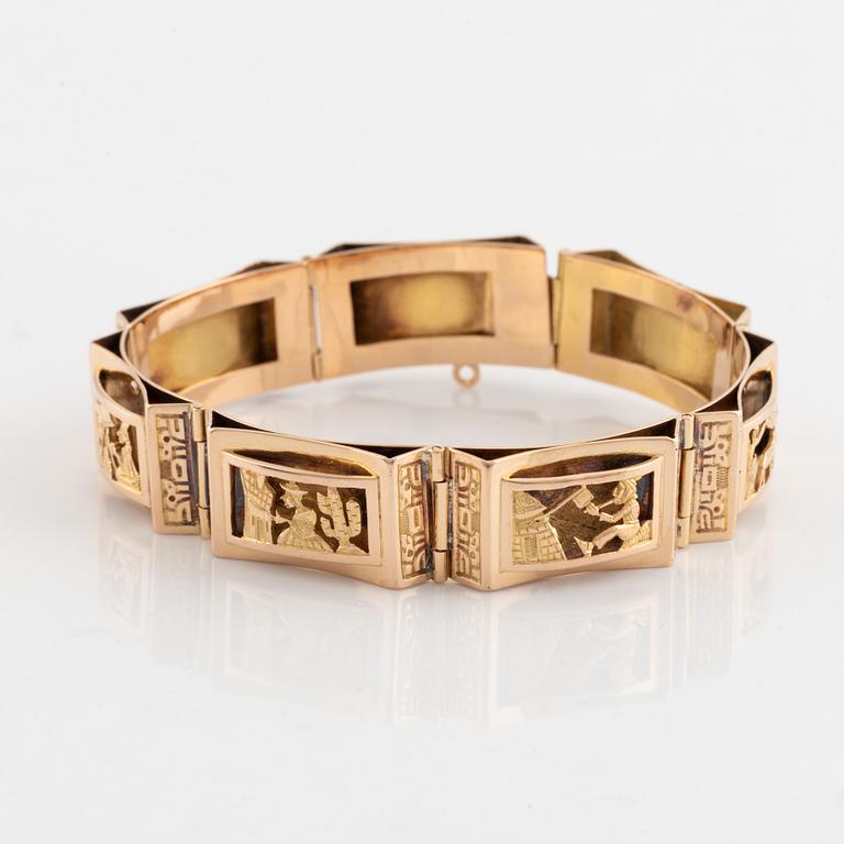 Gold panel bracelet.