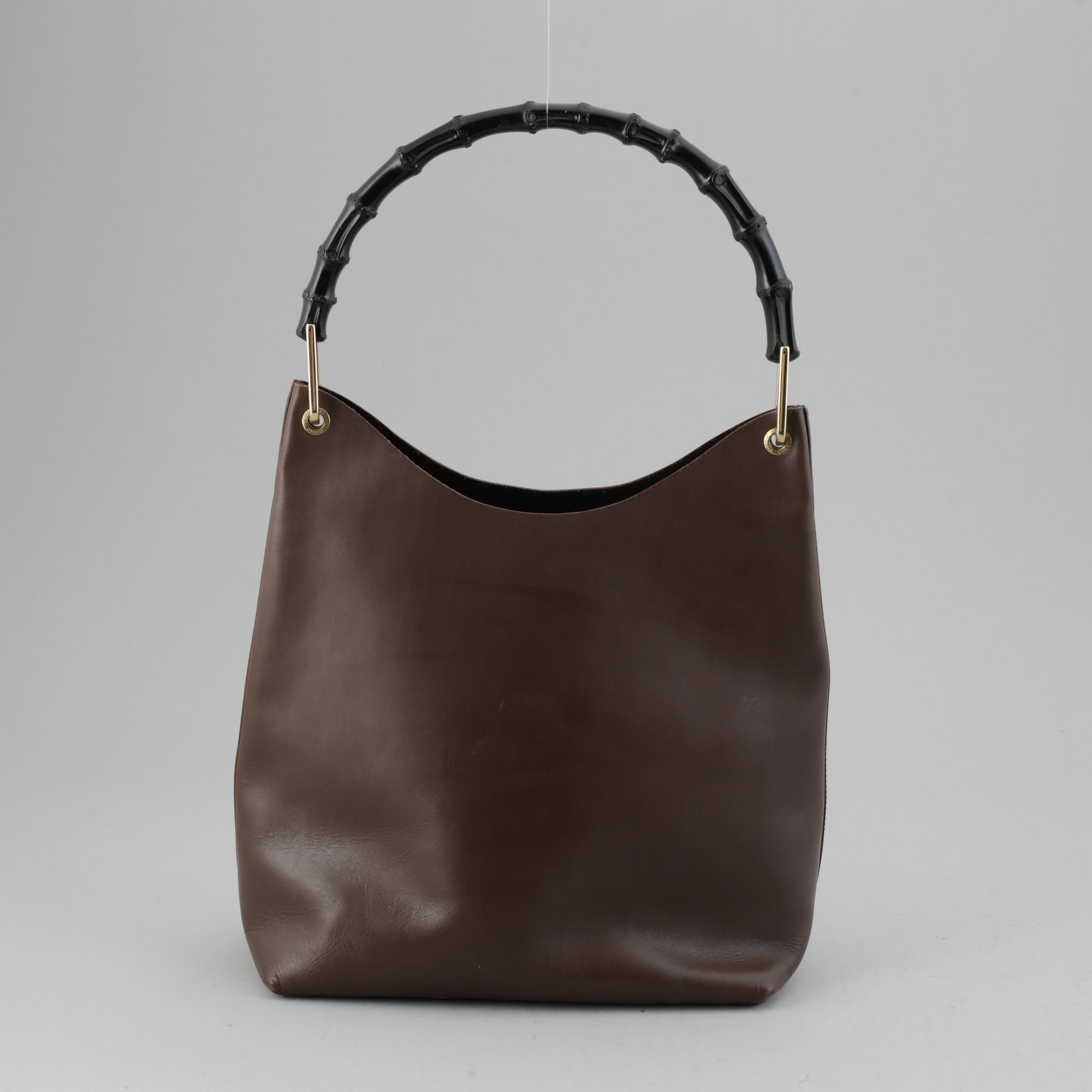 Gucci, a leather bag.