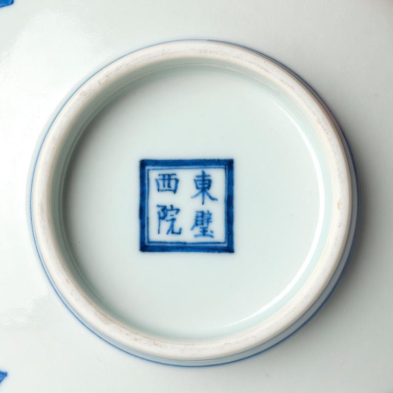 A blue and white heavily potted dish, Republic period with a mark.