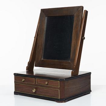 A mahogany table mirror, Sweden, dated 1820.
