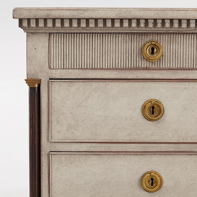 A chest of drawers, circa 1900.