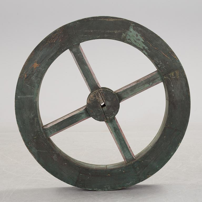 A early 20th century wooden wheel.