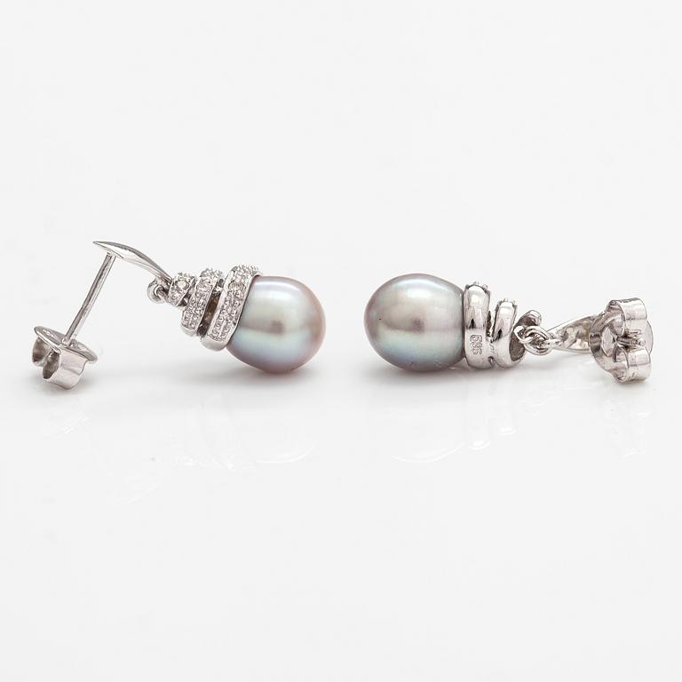 A pair of 14K white gold earrings with cultured pearls and diamonds ca. 0.06 ct in total. Caratia, Helsinki 2001.