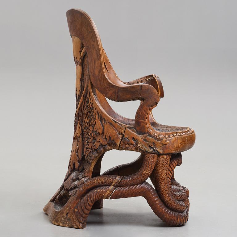 Knut Fjaestad, an Art Nouveau sculptured and carved pine throne, Sweden early 20th century.