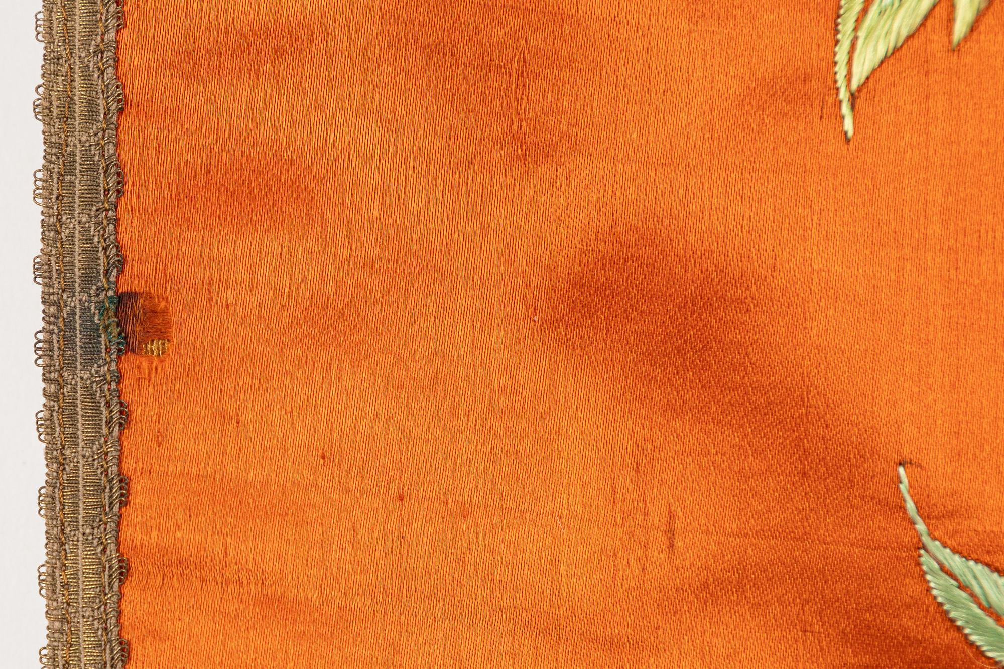 A Chinese embroidered textil fragment, late Qing dynasty/early 20th Century.