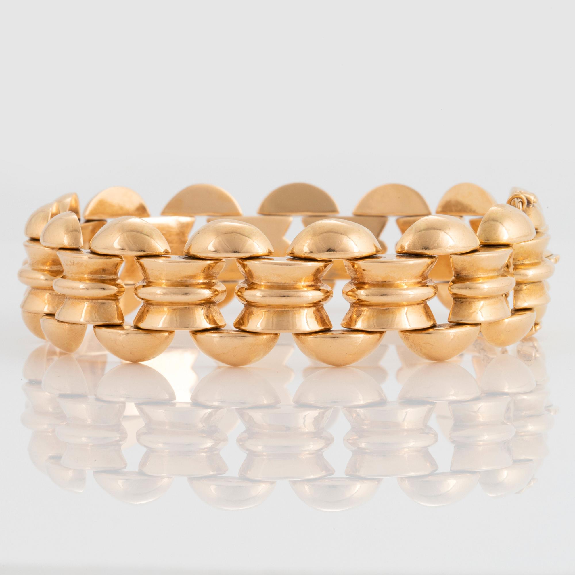 An 18K gold bracelet.