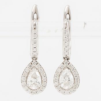 Earrings, a pair, 18K white gold set with pear-shaped and brilliant-cut diamonds.