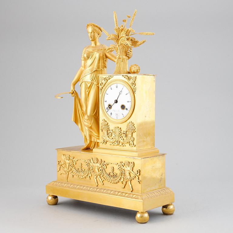 A French Empire gilt bronze mantel clock.