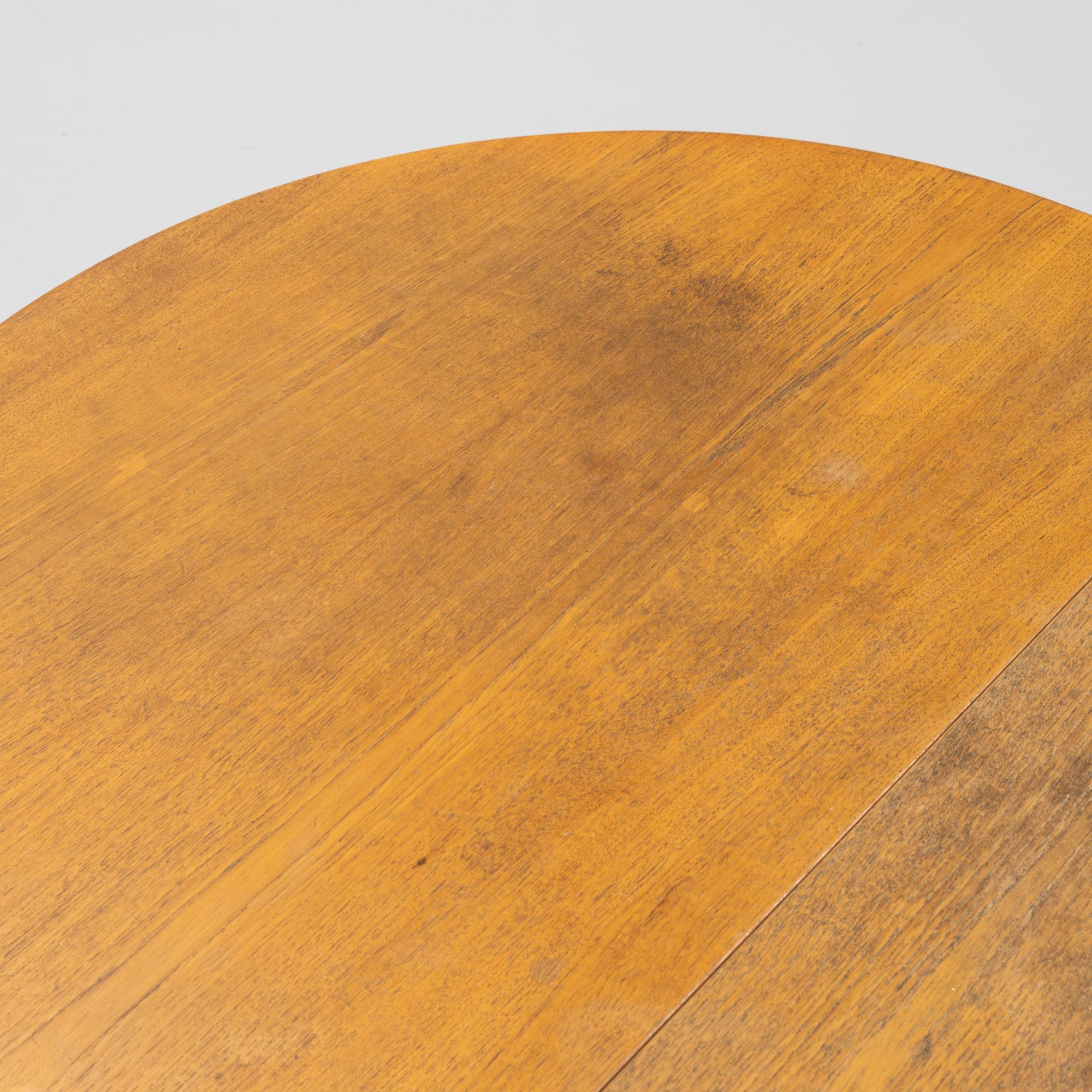 A gate-leg table, mid 20th Century.
