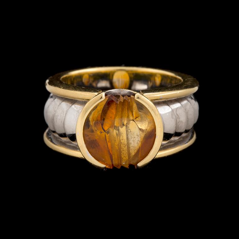 An 'On track' ring by Jan Jörgensen for Georg Jensen set with a fantasy cut citrine, ca 1980's.