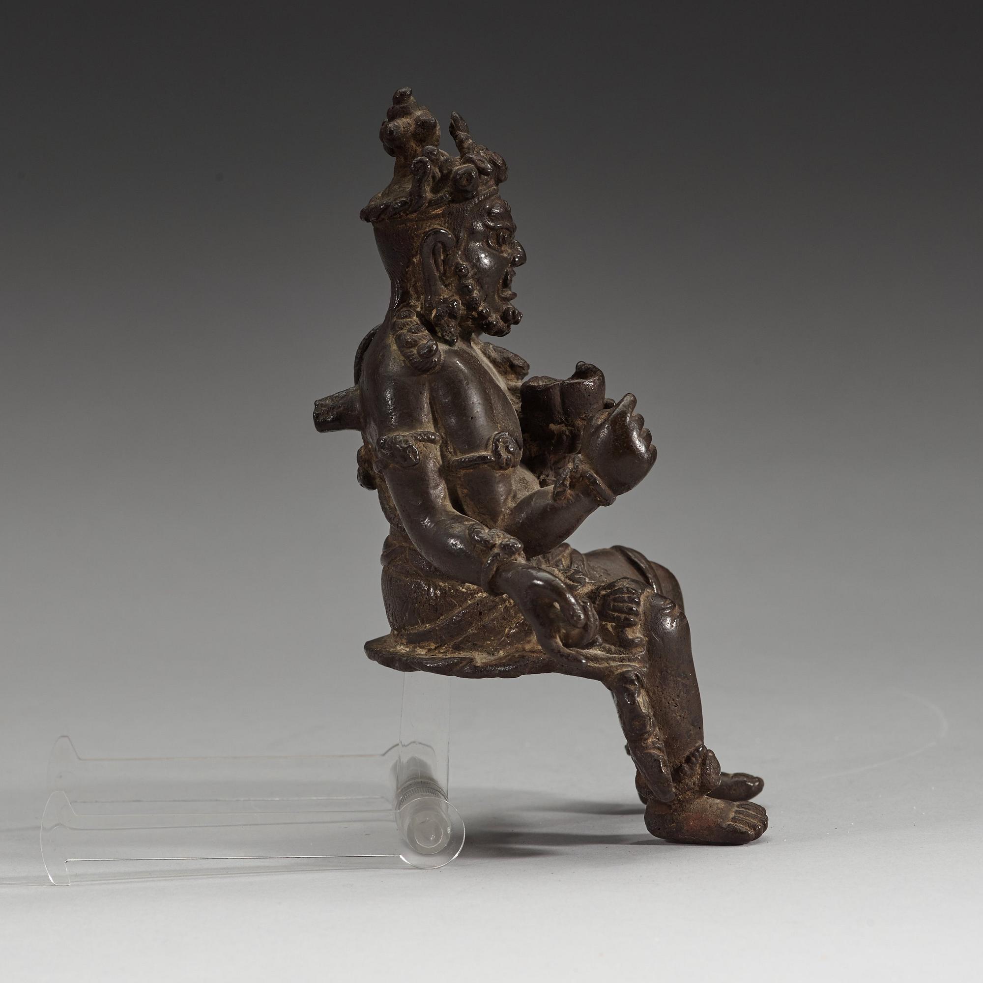 A seated bronze figurine of Mahakala, 15/16th Century or earlier.
