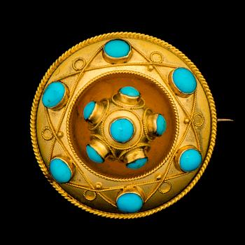 A BROOCH, cabochon cut turquoise, 14K gold.