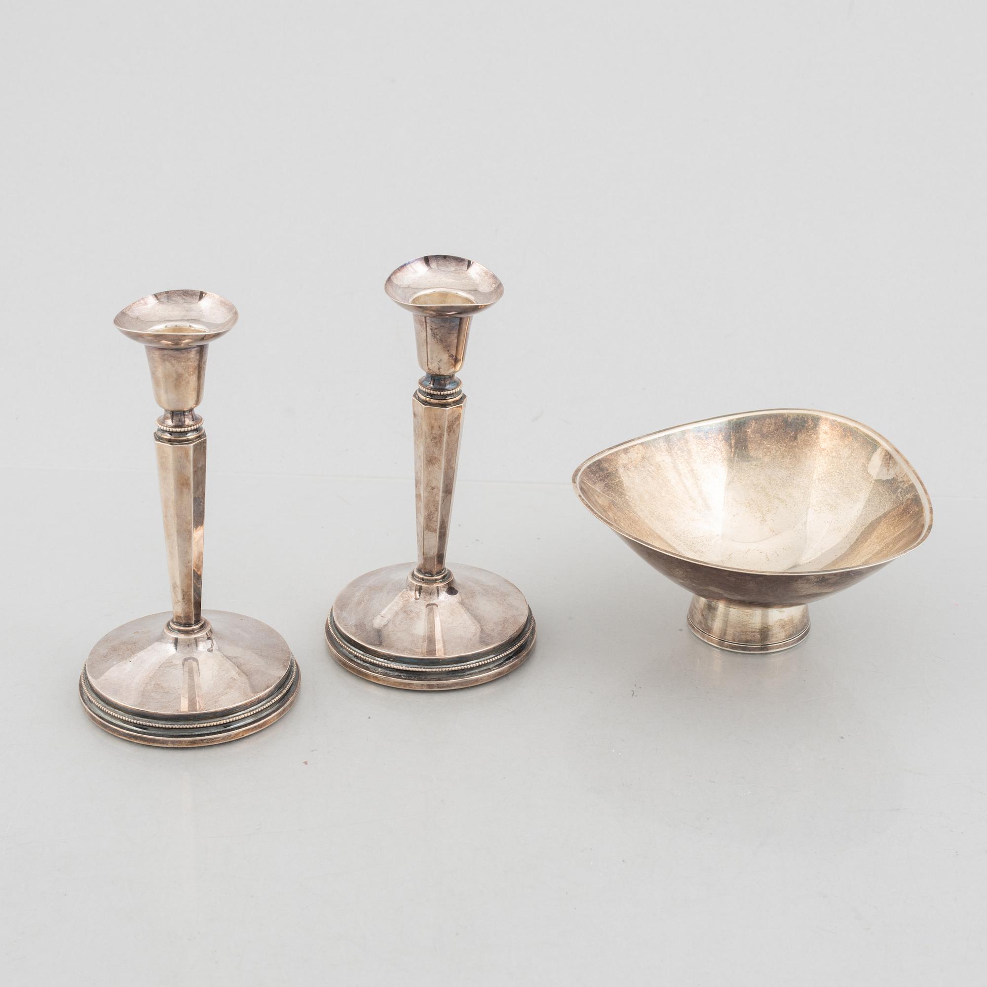A pair of silver candlesticks, MGAB, Uppsala, Sweden, 1973, and a silver bowl by Gustaf Janson, CGH, Sweden, 1959.