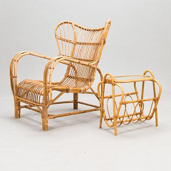 A 1950s rattan easy chair with ottoman and a magazine stand, Urjalan Koritehdas, Finland.