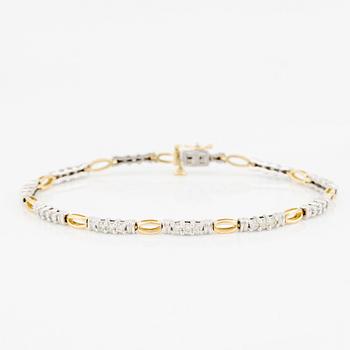 Armlänk, 14K guld med briljantslipade diamanter.