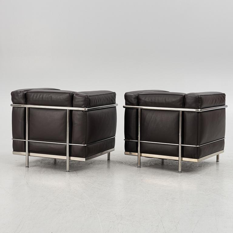 Pierre Jeanneret, Charlotte Perriand & Le Corbusier, a pair of 'LC2' armchairs, Cassina, Italy.