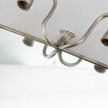 Two pewter wall sconces from Firma Svenskt Tenn, 1925.