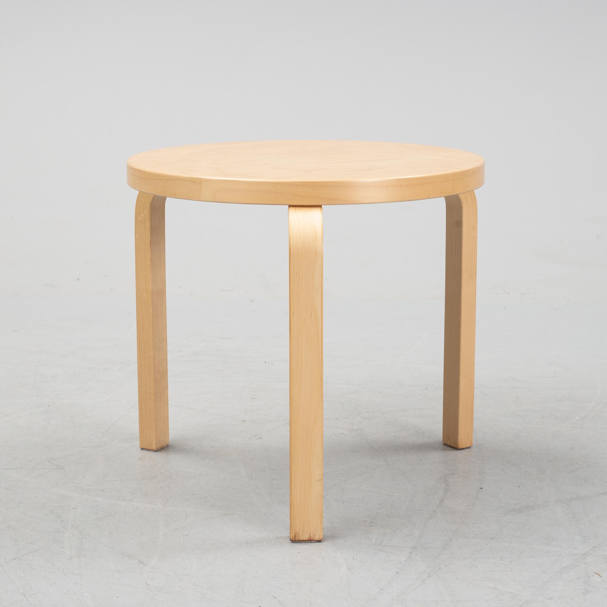 A bench and a stool by Alvar Aalto, from around the year 2000.