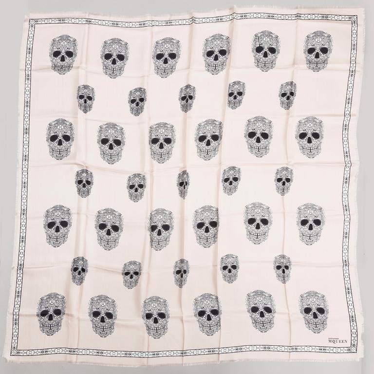 A scarf by ALEXANDER McQUEEN.