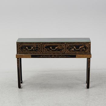 A Chinese black and gilt lacquered cupboard, 20th century.