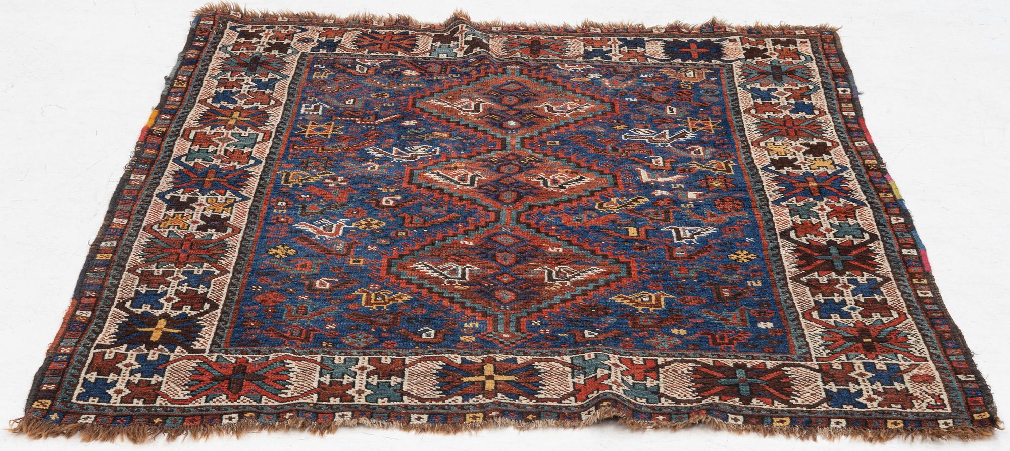 An antique Kamseh rug, c. 150 x 118 cm.