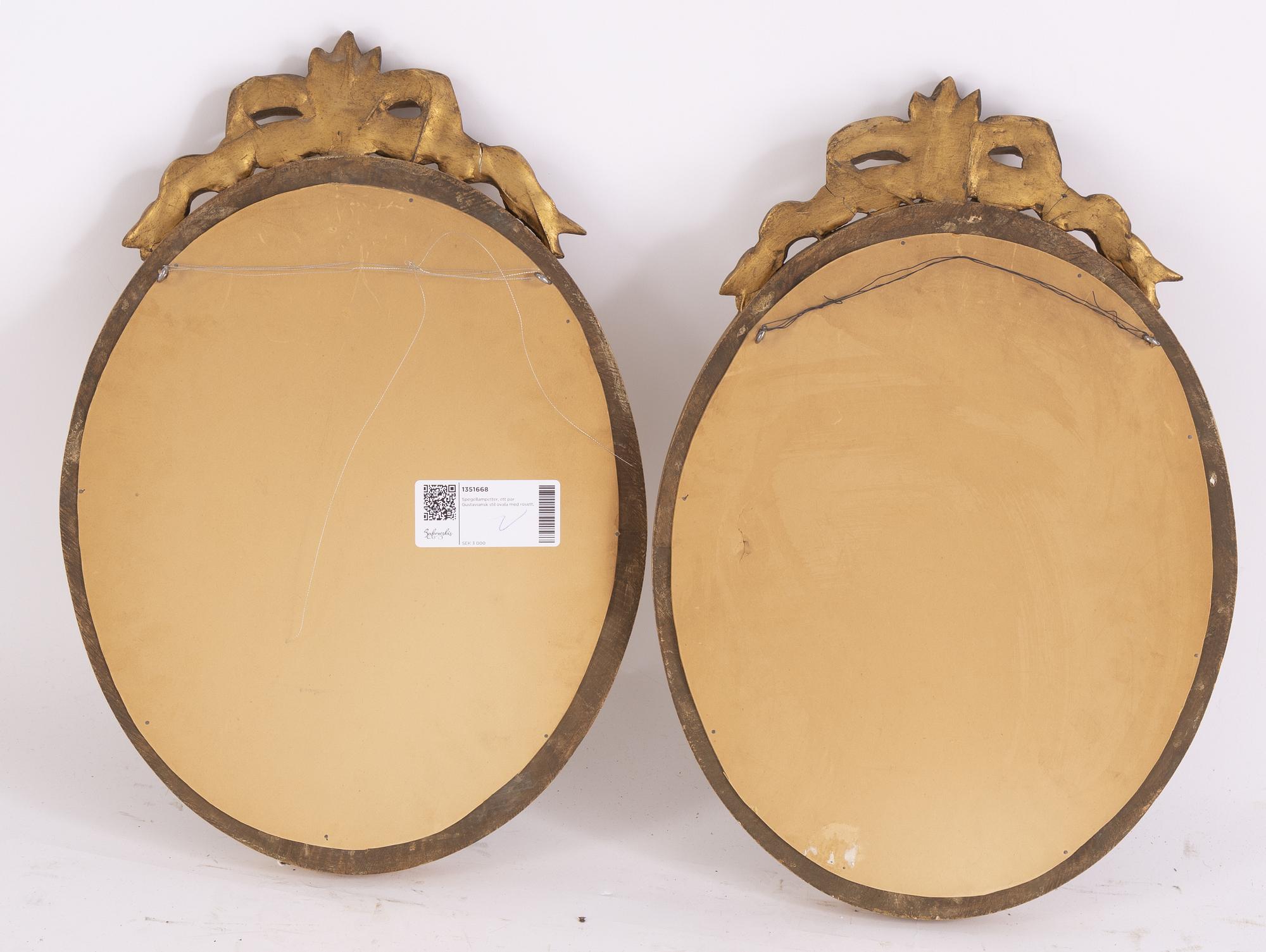 A pair of Gustavian style giltwood and parcel-gilt mirrors from around year 1900.