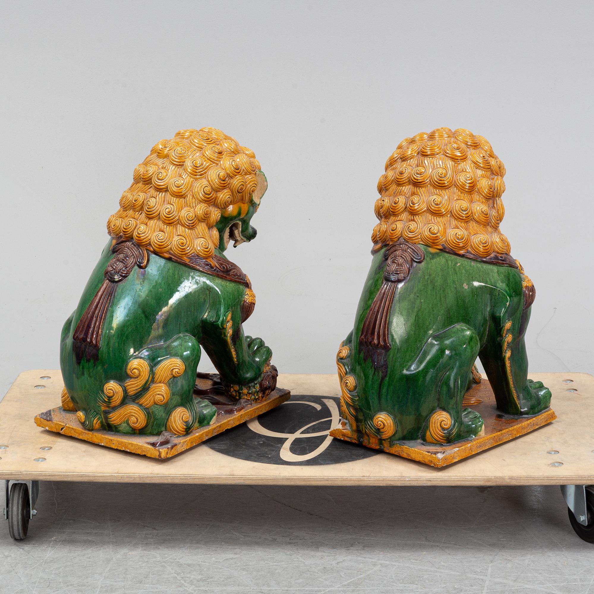 A pair of sancai-glazed chinese buddhist lions or guardian lions, early 20th century.