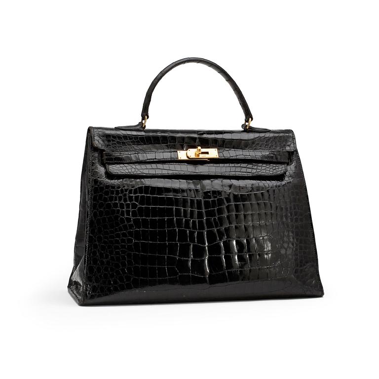 HERMÈS, a black crocodile "Kelly 35" bag from the 1960s.