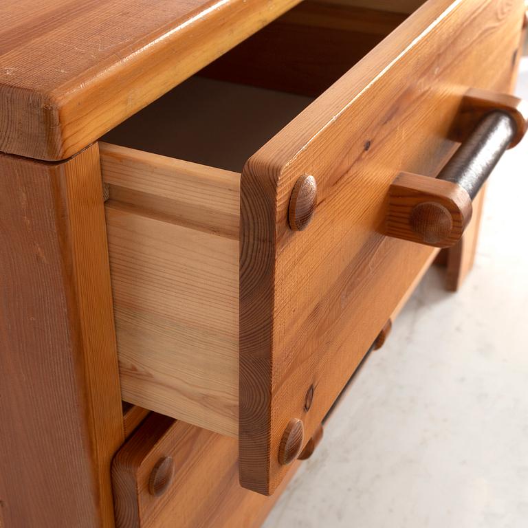 A 1970's set with a pine mirror and chest of drawers.