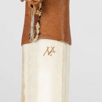 A reindeer horn knife by Nils Per Partapuoli, signed.