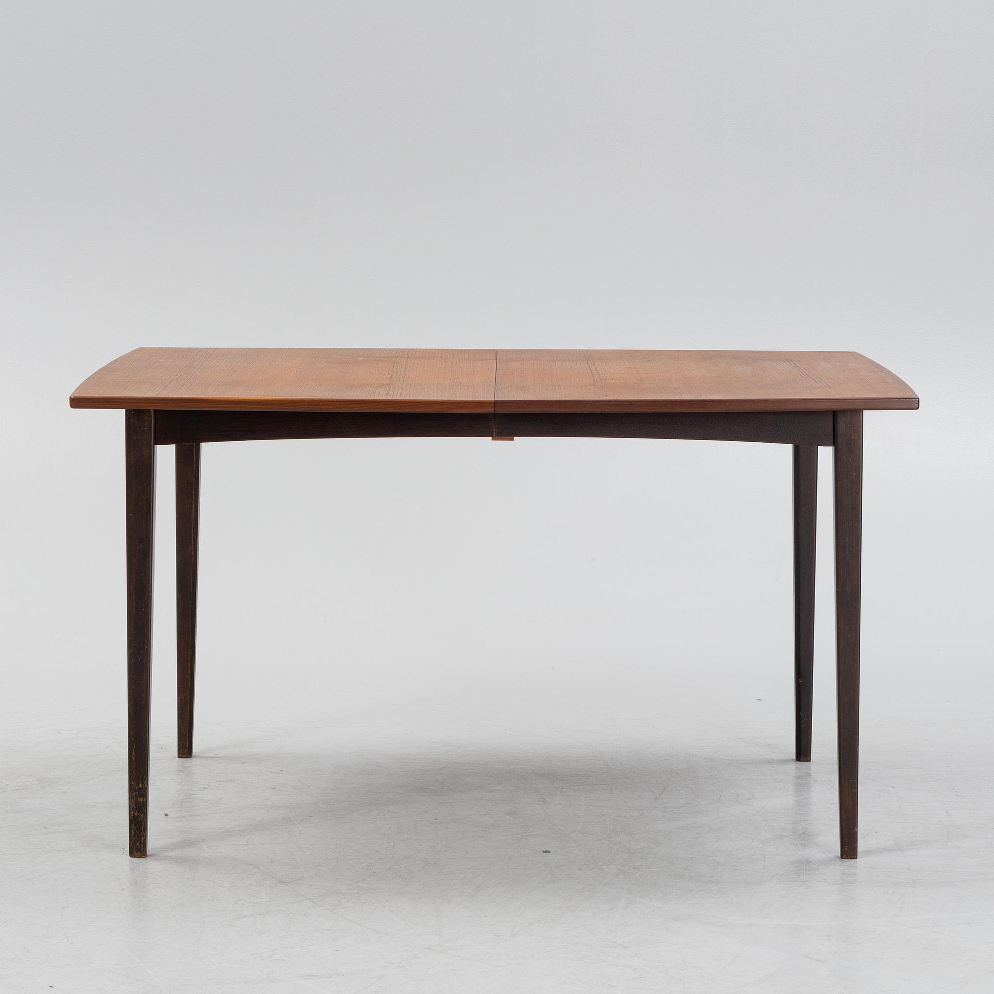 A teak dining table, mid 20th Century.