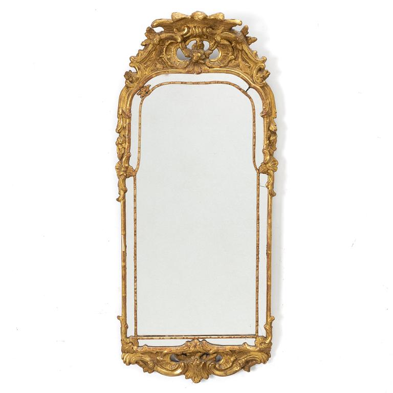 A gilt-gesso rococ-style mirror, 20th century.