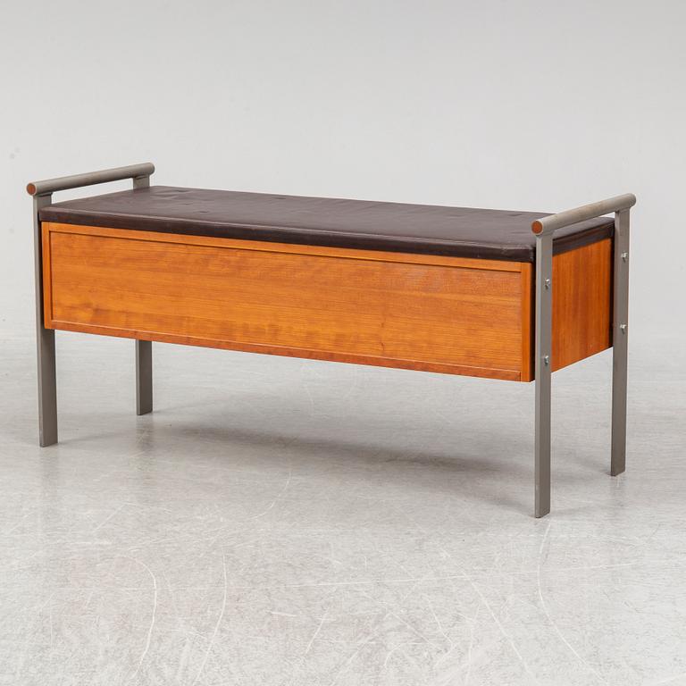 A contemporary leather and metal bench.