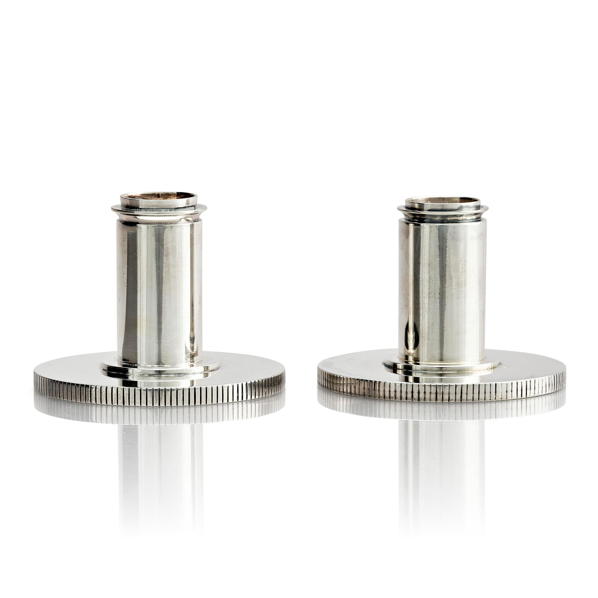 Georg Jensen, a pair of sterling silver candlesticks, design by Sigvard Bernadotte, model no 711A, Copenhagen, Denmark after 1945.