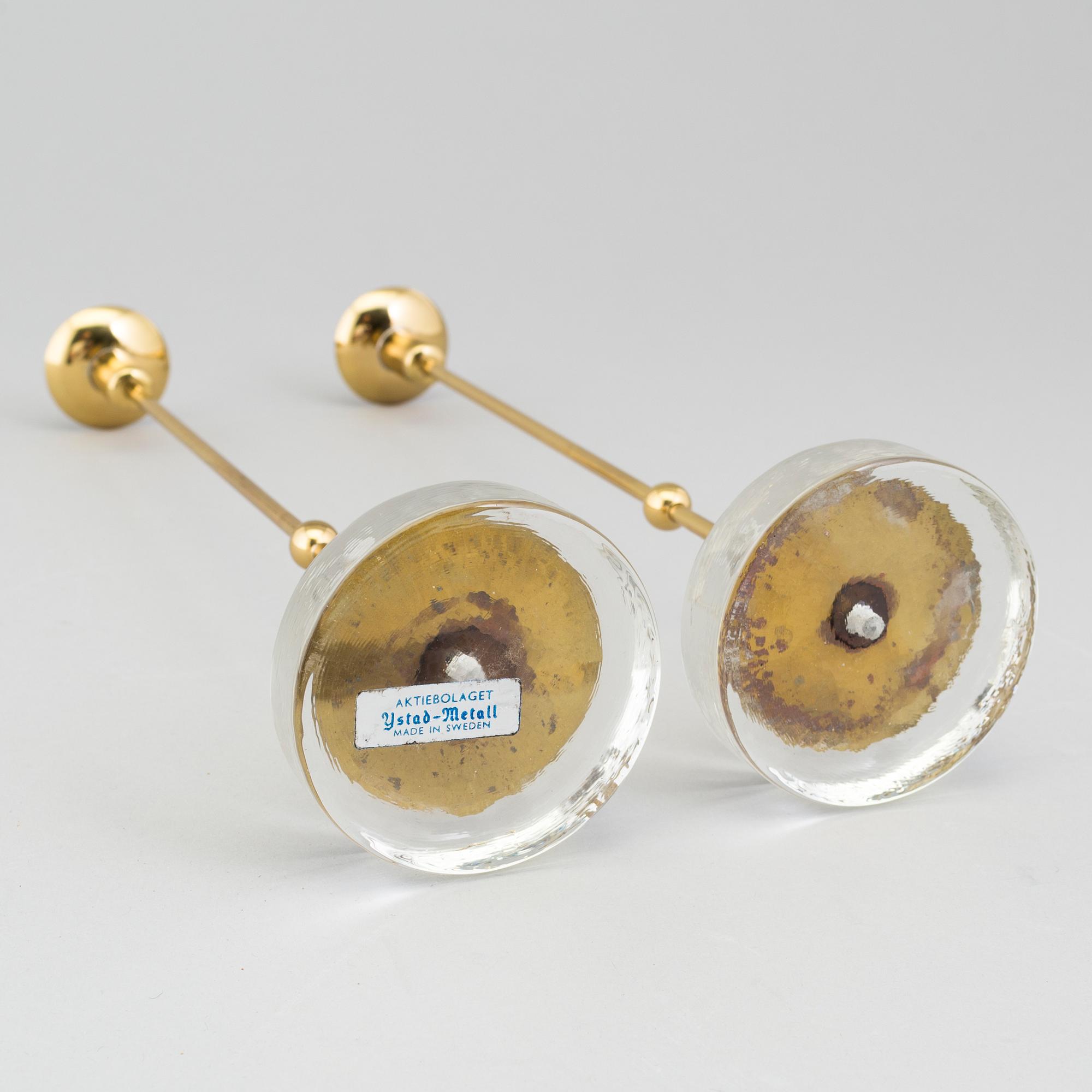 GUNNAR ANDER, A pair of Ystad metall brass candlesticks.
