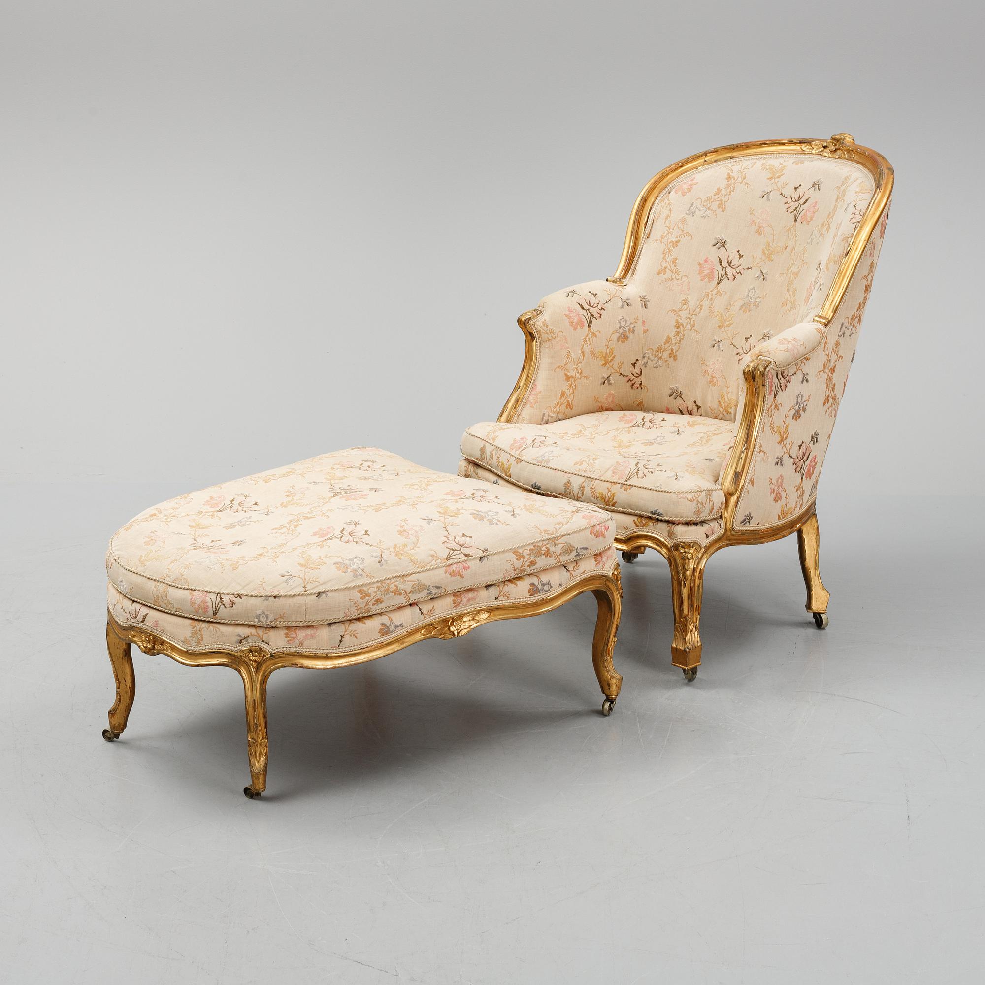 A Louis XV-style bergère armchair with stool, second half of the 19th century.
