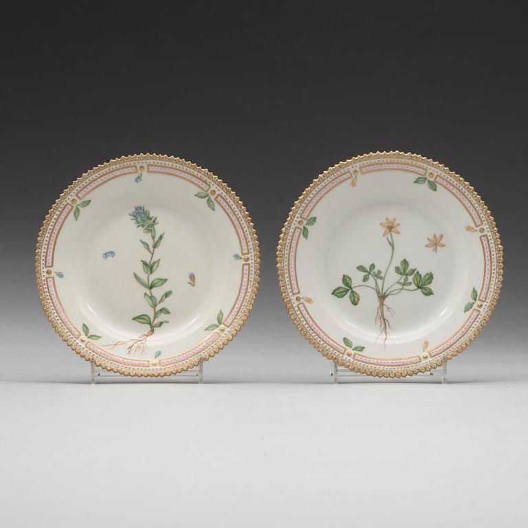 A set of eight cups with stands and six dessert dishes, Royal Copenhagen, 'Flora Danica', 20th Century.