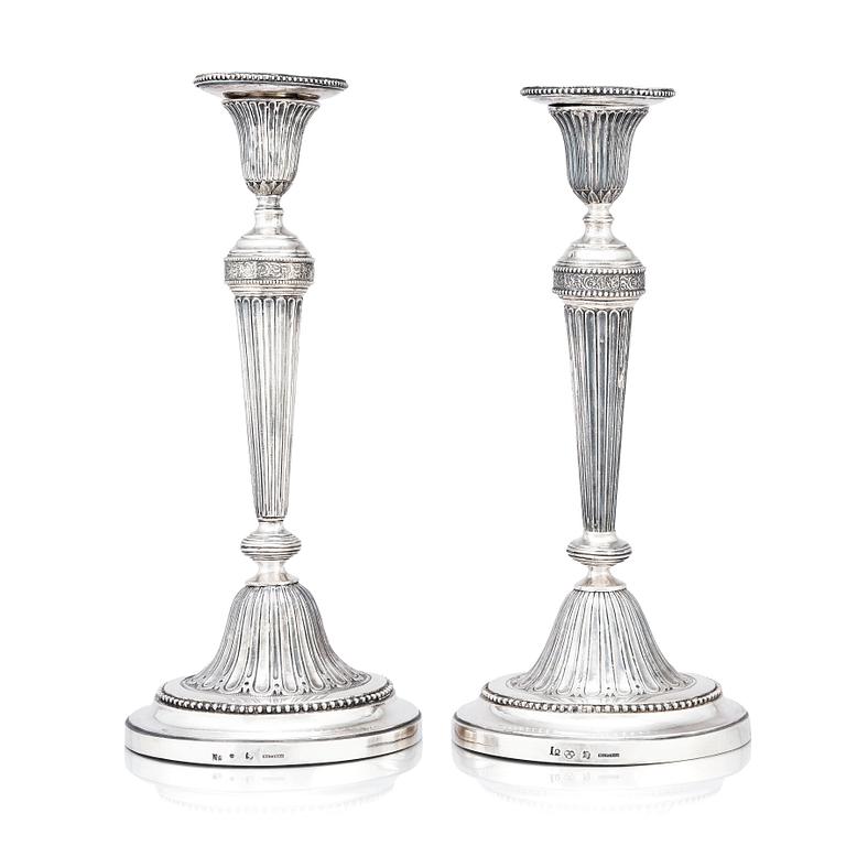 A pair of Swedish Gustavian silver candlesticks, marks of Mikael Nyberg, Stockholm 1790 and 1791.