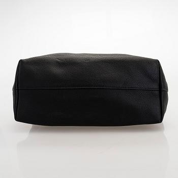 Prada, A 'Vitello Daino Tote' bag.