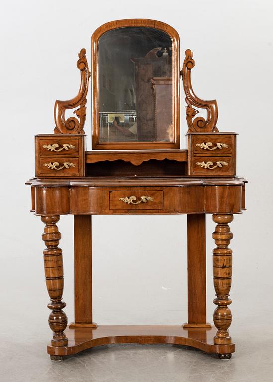 A second half of the 19th century table with mirror and a stool.