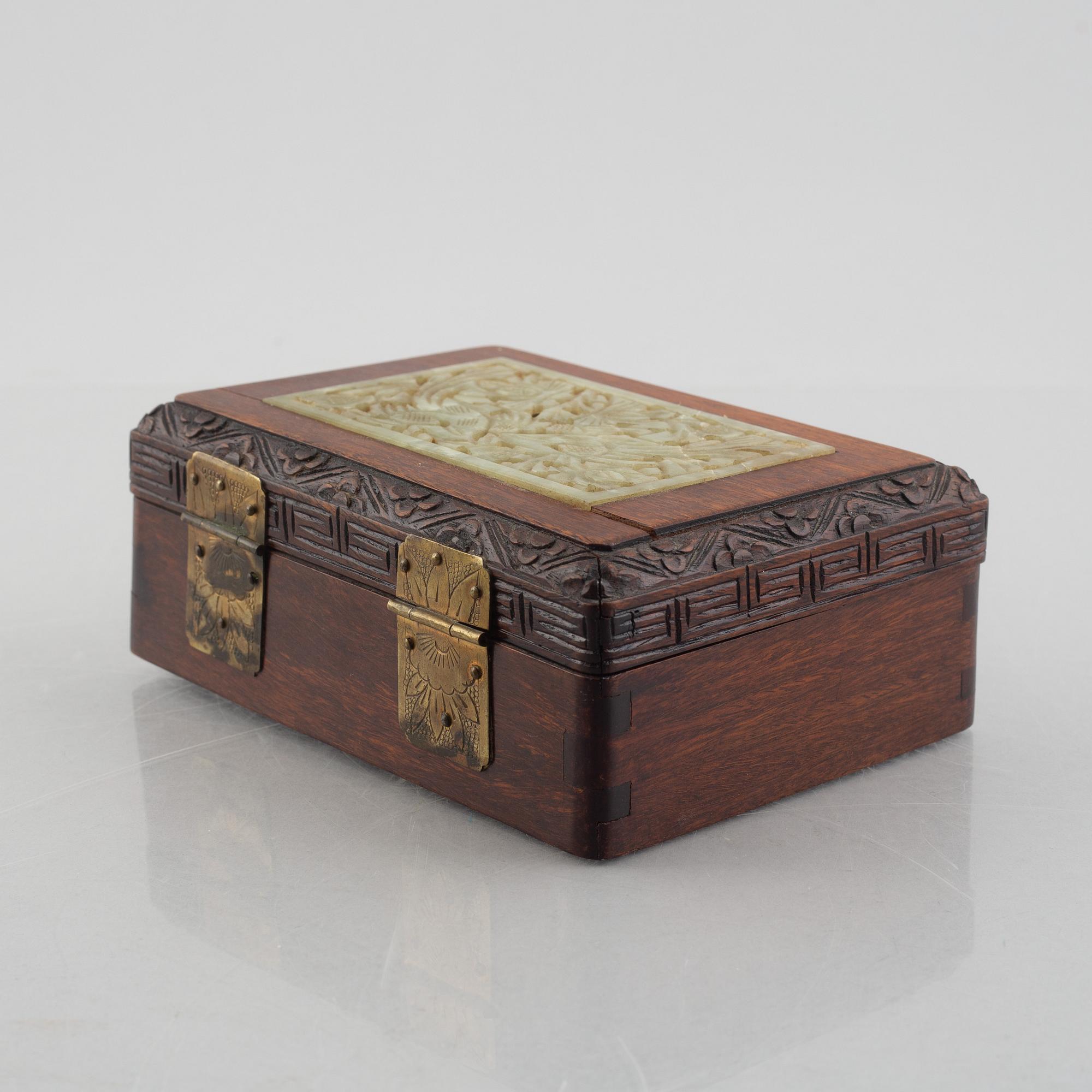 Two Chinese hardwood boxes with nephrite plaques, 20th century.