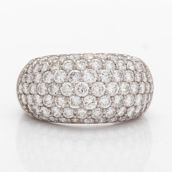 A platinum bombé ring with brilliant-cut diamonds.