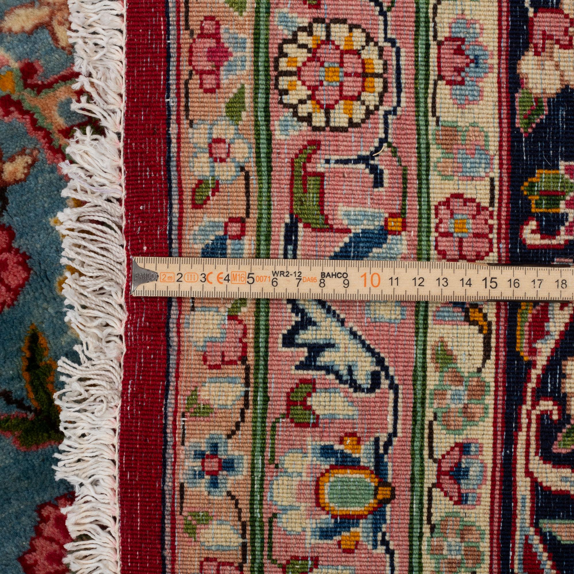 A carpet, semi-antique Kirman, signed, circa 400 x 300 cm.