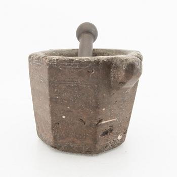 A Swddish 18th/19th century limestone and cast iron mortar.