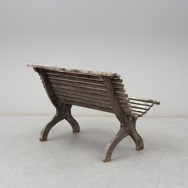 A painted pine garden sofa, 20th Century.