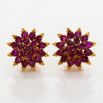 A pair of 18K gold earrings and rubies.