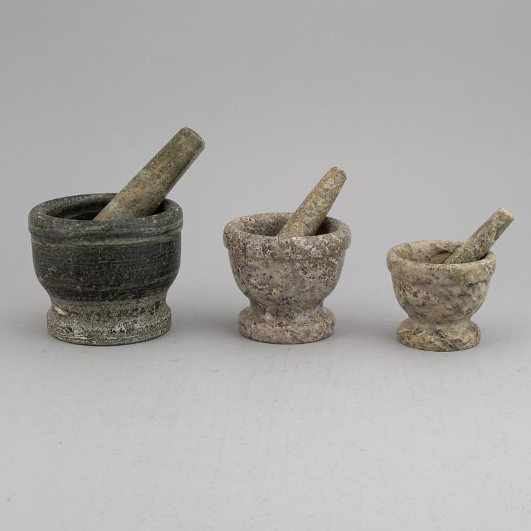 Three swedish green marble mortars and pestles, 20th century.