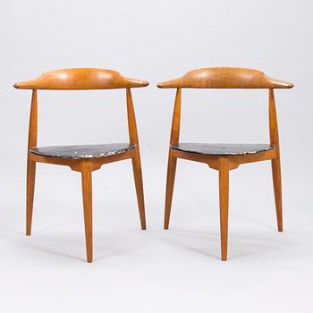 A pair of "Hjertestolen" by Hans J Wegner produced for Fritz Hansen.